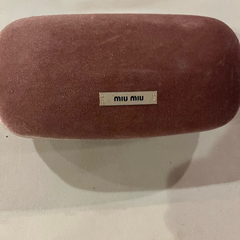 Miu Miu pink sunglasses case .